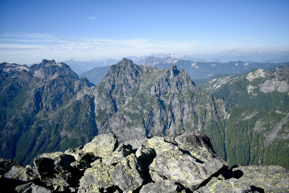 gray rocky mountain under blue sky during daytime