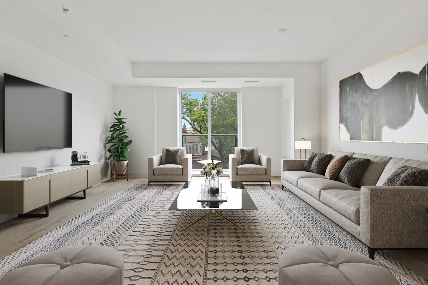 Bright open living room with a patterned rug and large windows