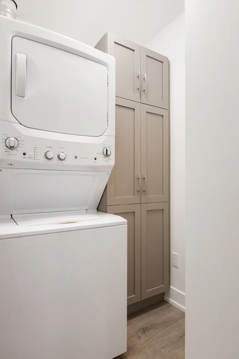 White front-load washing machine, illustrating a washer that should be draining fully at the end of a cycle