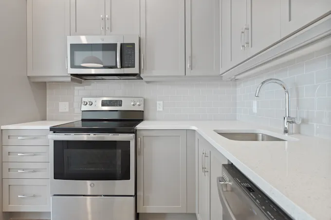 White microwave oven on a kitchen counter serviced by an Altoona appliance repair technician