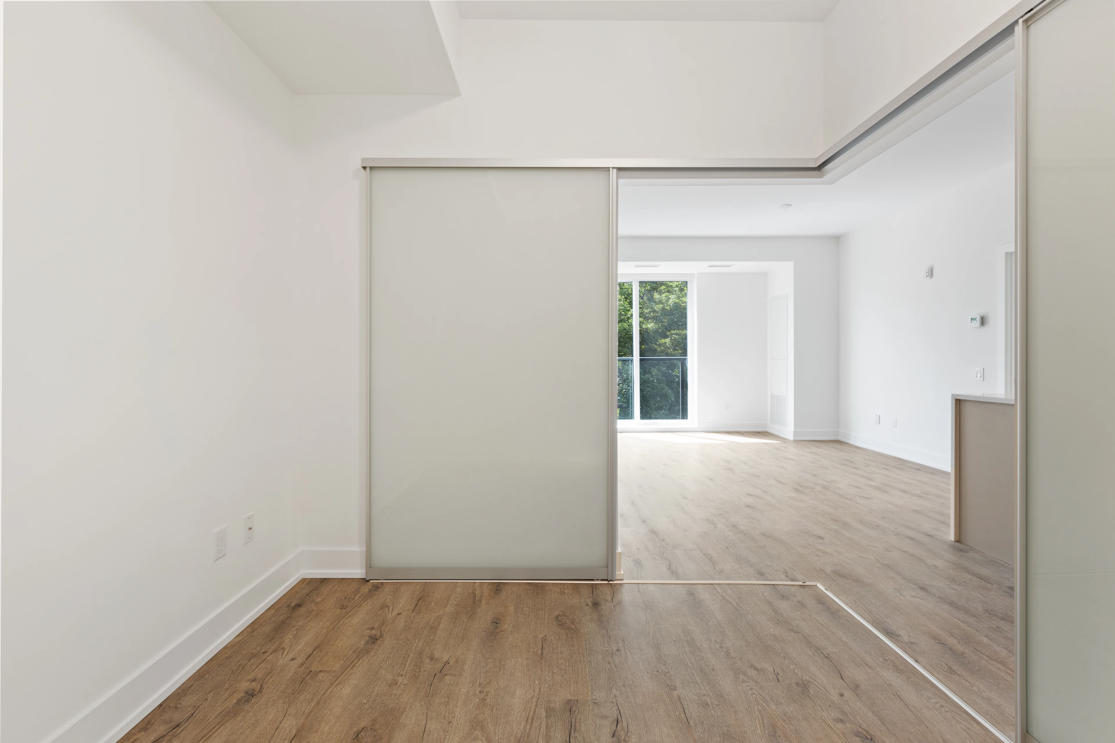Empty bedroom with a built-in wardrobe