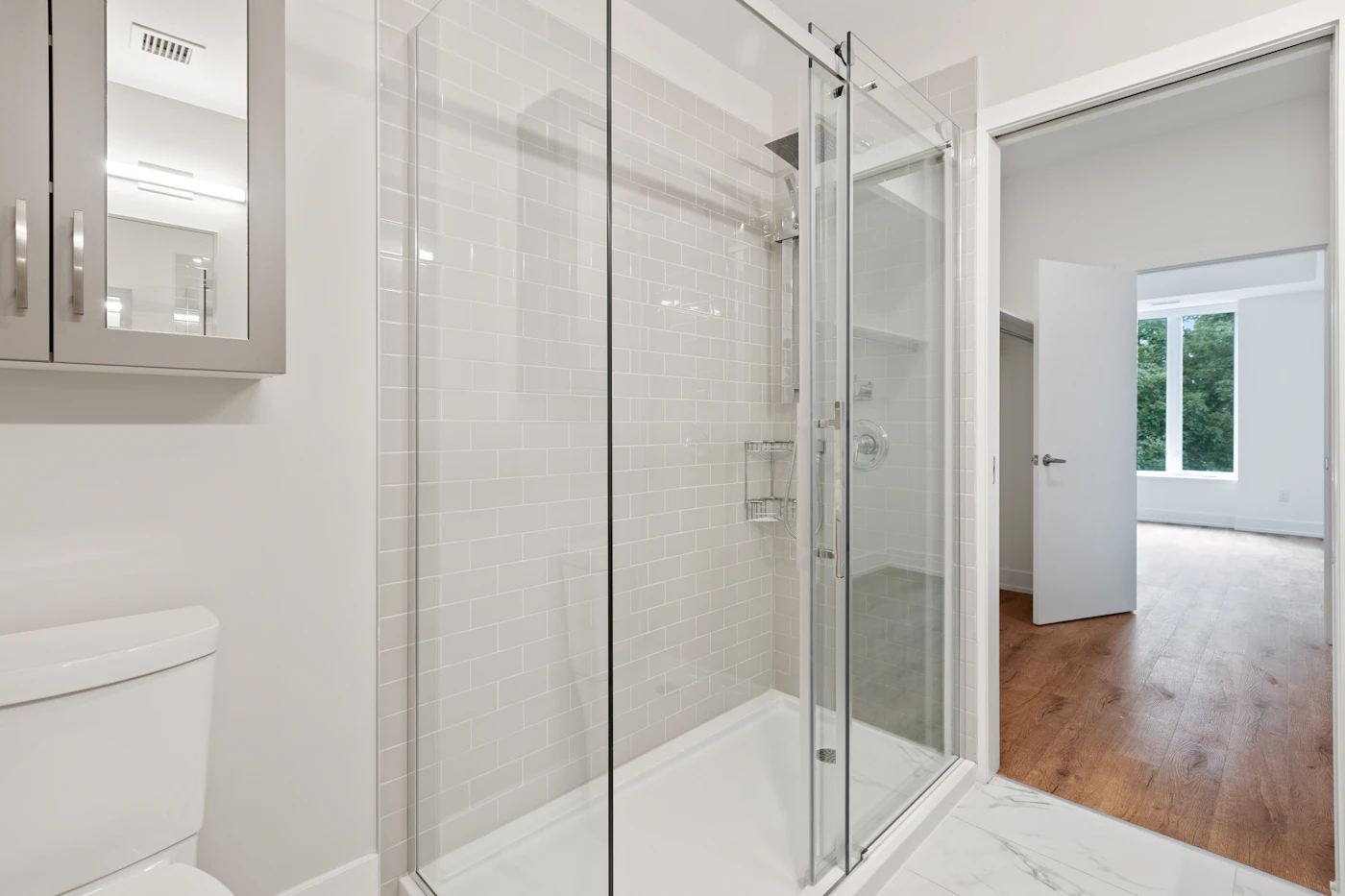 A curbless glass walk-in shower conversion