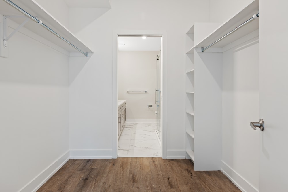 white wooden door on brown wooden parquet floor