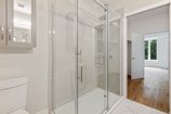 clear glass door with white steel frame