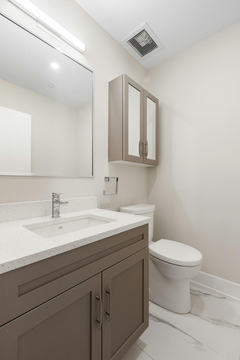 white ceramic sink with stainless steel faucet