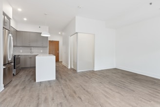 white wooden cabinet near white wall