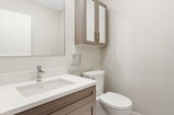 white ceramic sink with stainless steel faucet