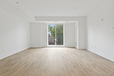 white wooden framed glass door