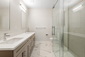 white ceramic sink near mirror