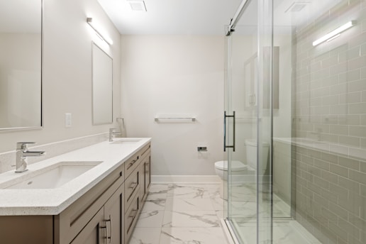 white ceramic sink near mirror