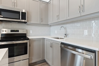 silver and black microwave oven