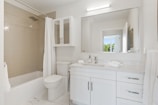white ceramic sink with mirror