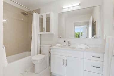 white ceramic sink with mirror