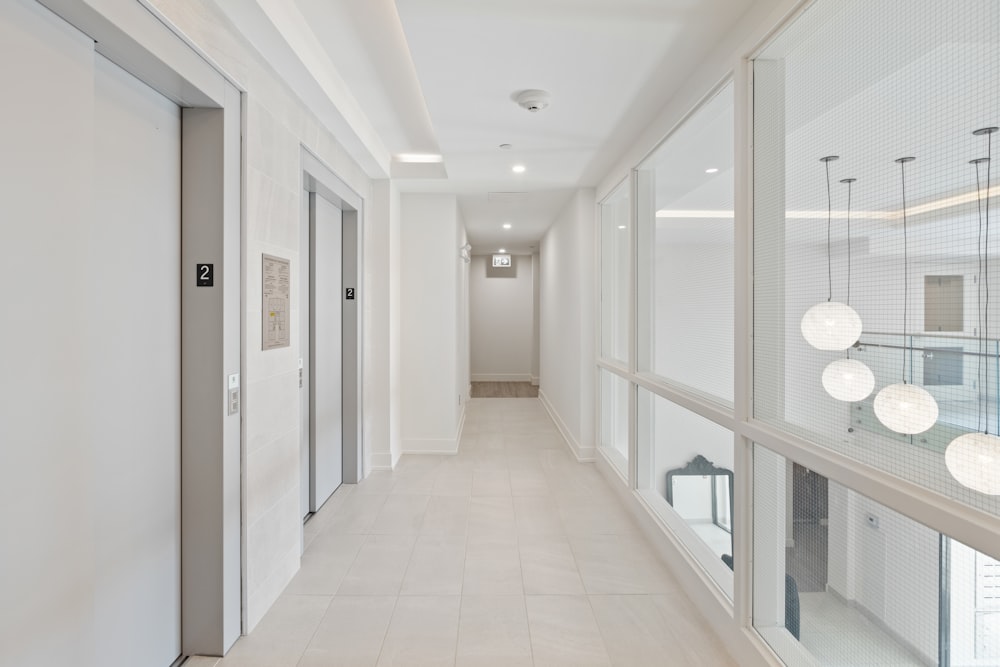 white and brown hallway with white walls