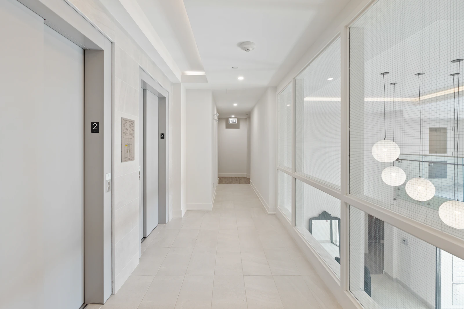 White and brown hallway with white walls