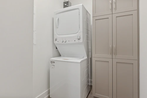 a washer and dryer in a small room