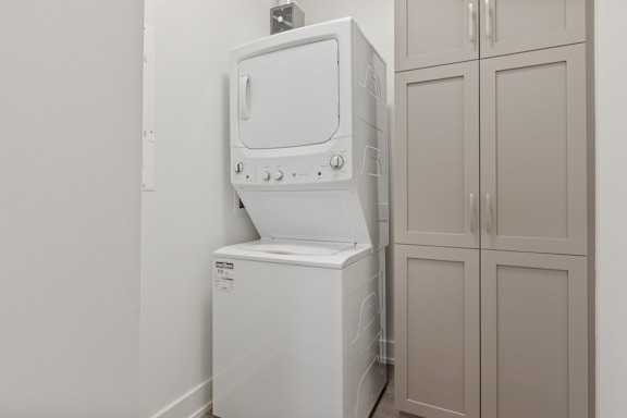 a washer and dryer in a small room