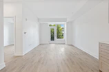 white wooden door on white painted wall