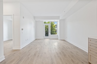 white wooden door on white painted wall