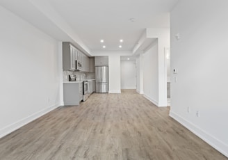 brown wooden parquet floor and white wall