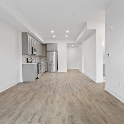 brown wooden parquet floor and white wall