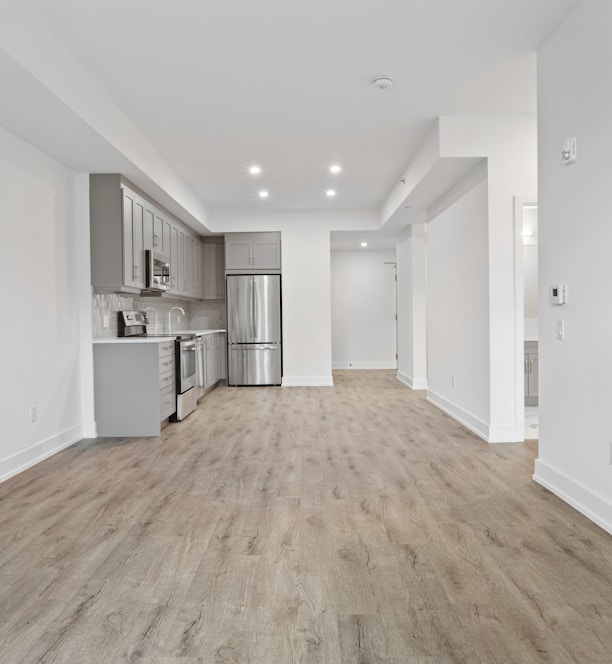 brown wooden parquet floor and white wall