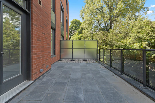 brown brick building near green trees during daytime