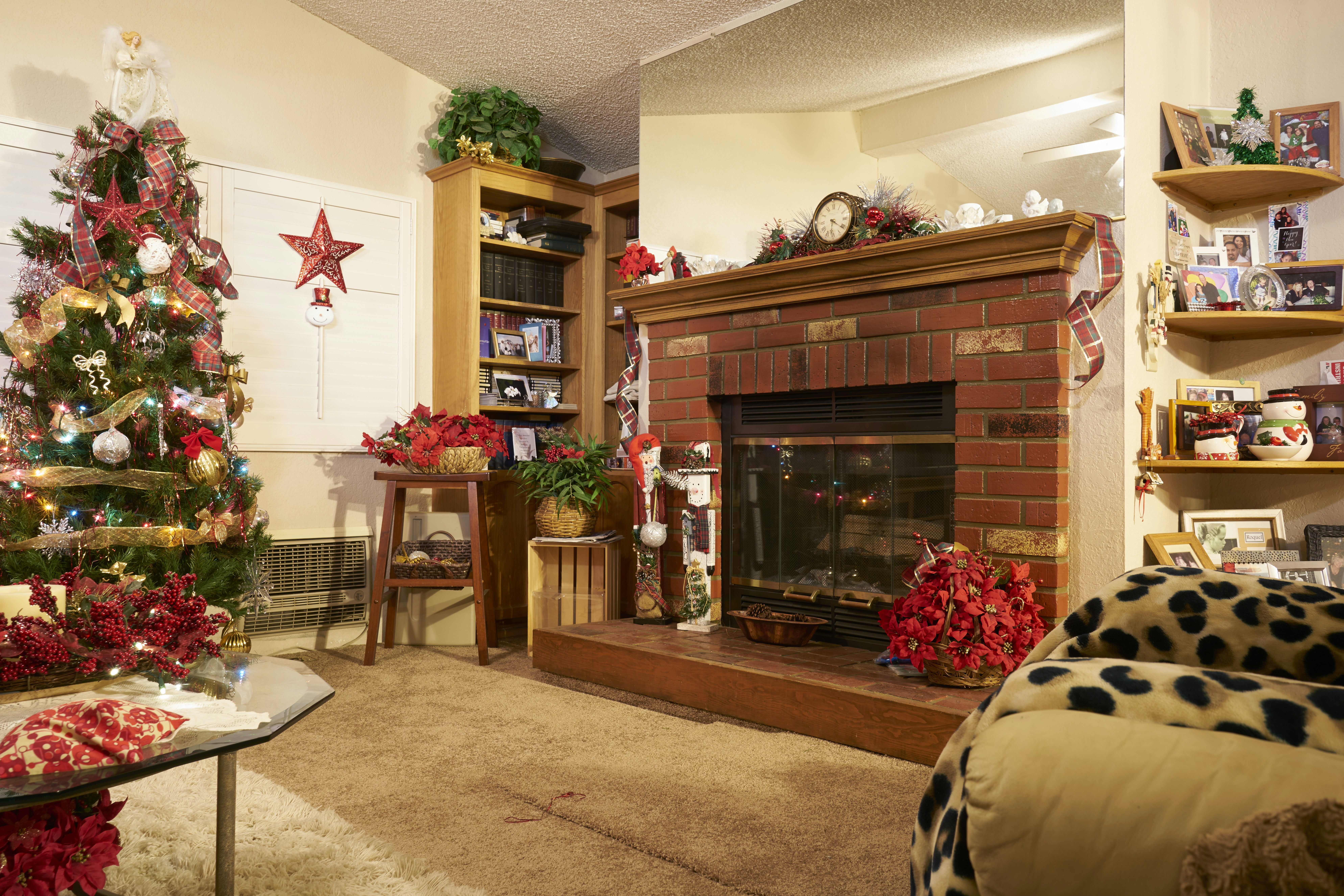 brown wooden fireplace mantle with christmas tree