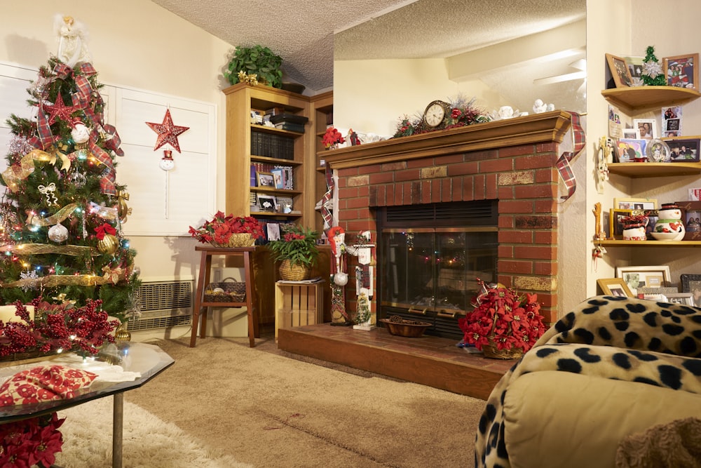 brown wooden fireplace mantle with christmas tree
