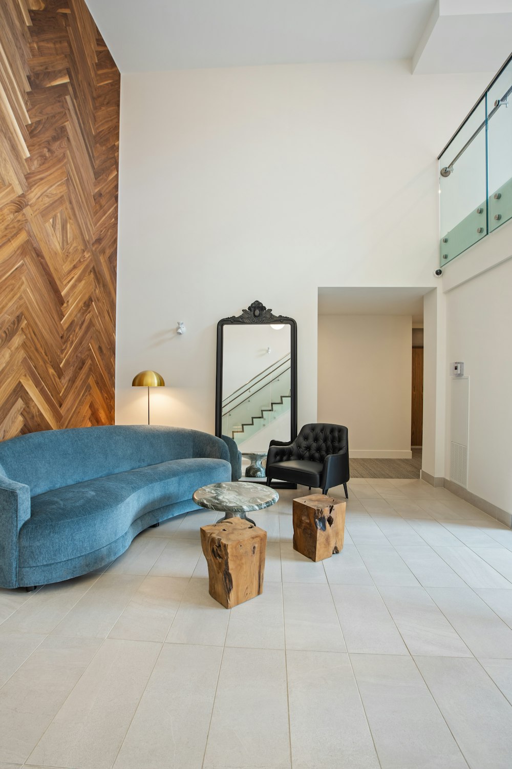 blue sofa near brown wooden cabinet