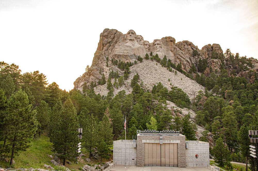 white concrete building near mountain