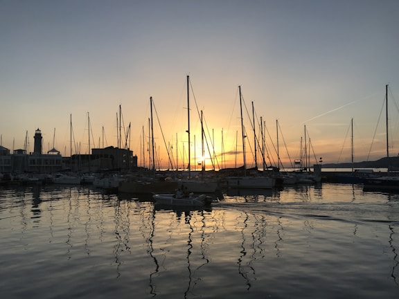 Sunset casting golden hues over sailboats docked at Bear Lake Yacht Club.