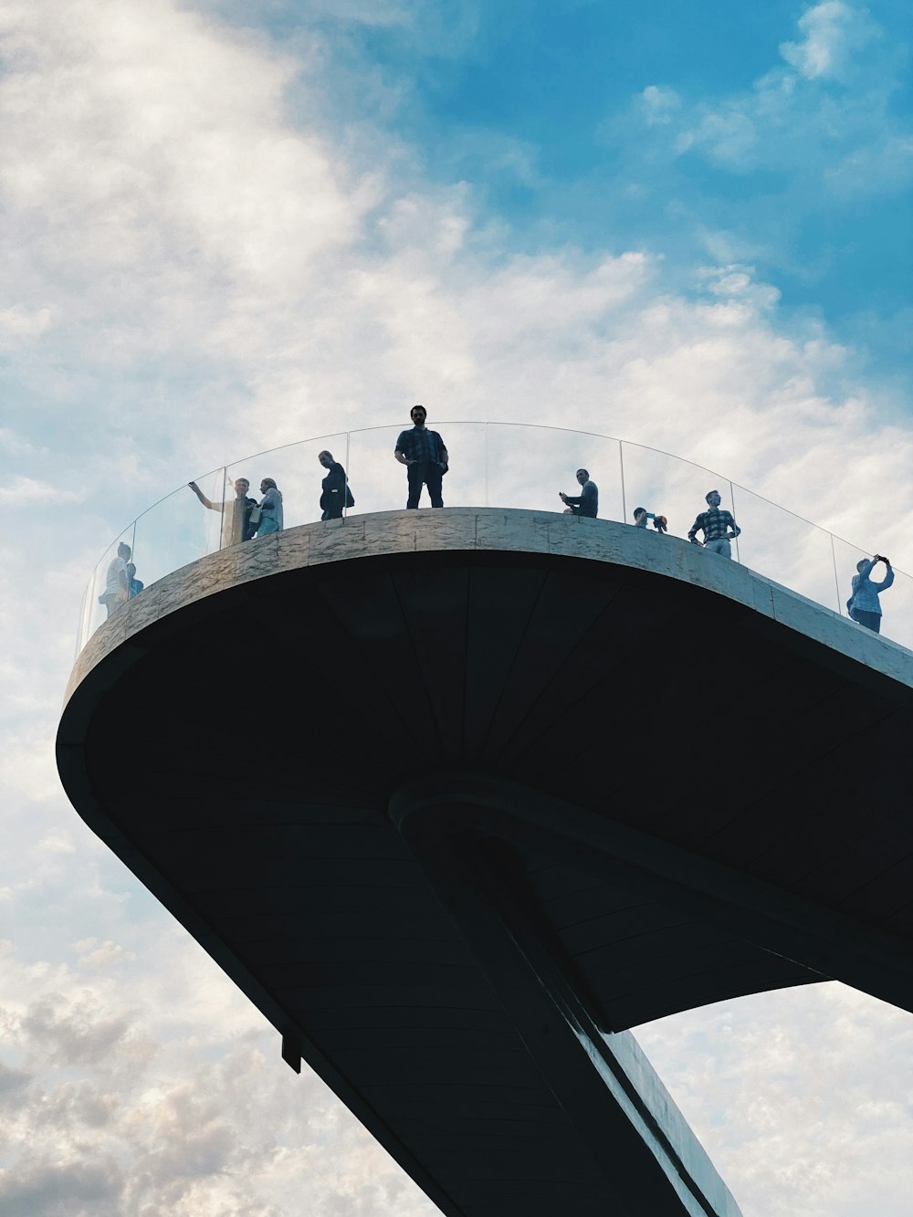 people standing on top of building during daytime