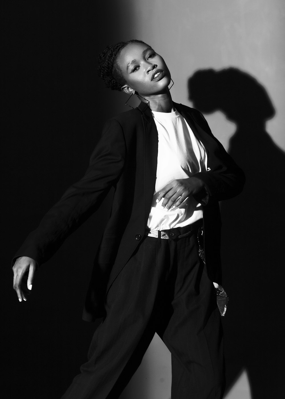 Fashion model in a tailored suit demonstrating editorial photography