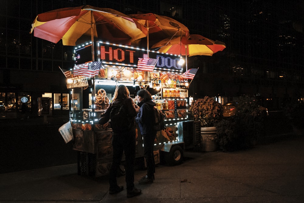 people walking on street during night time