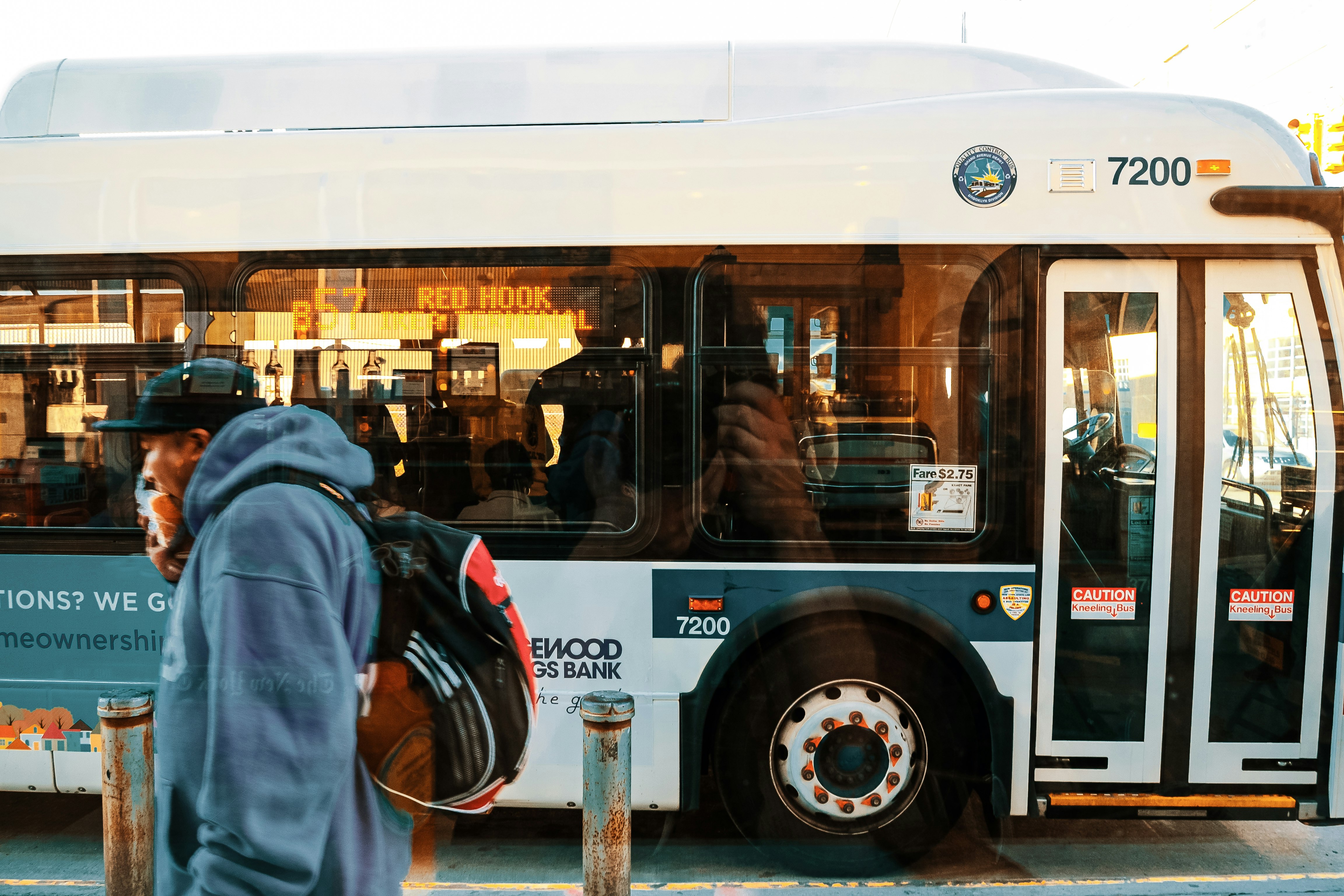 white and black bus in front of store