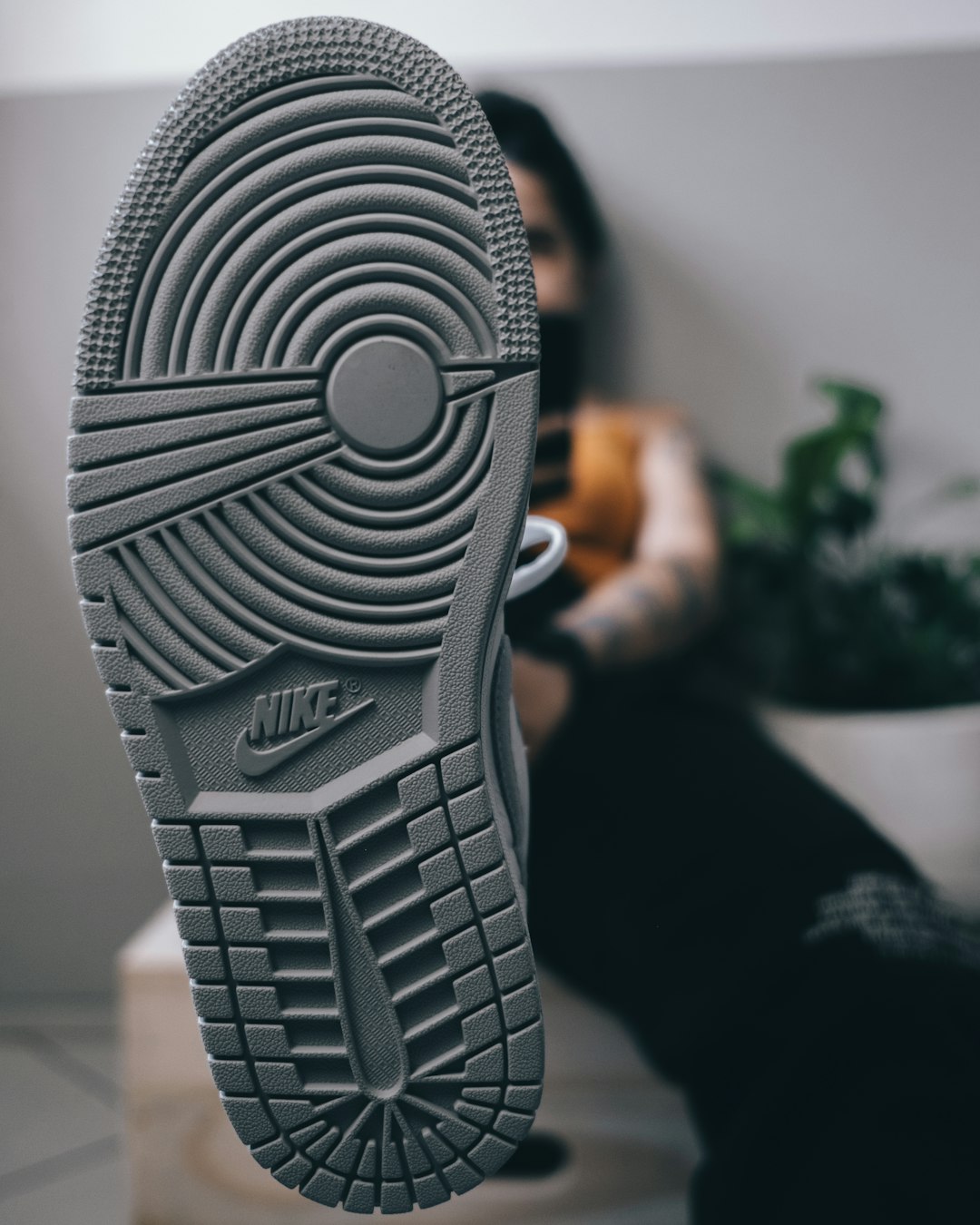 person holding gray plastic toy