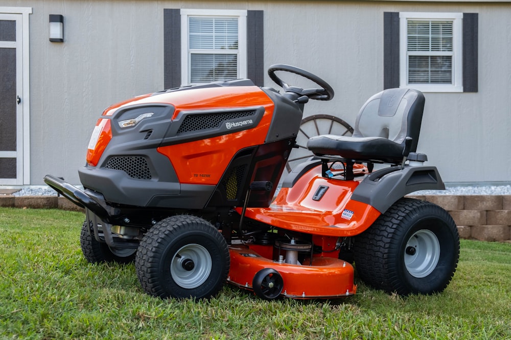 red and black ride on lawn mower