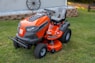 orange and black ride on lawn mower
