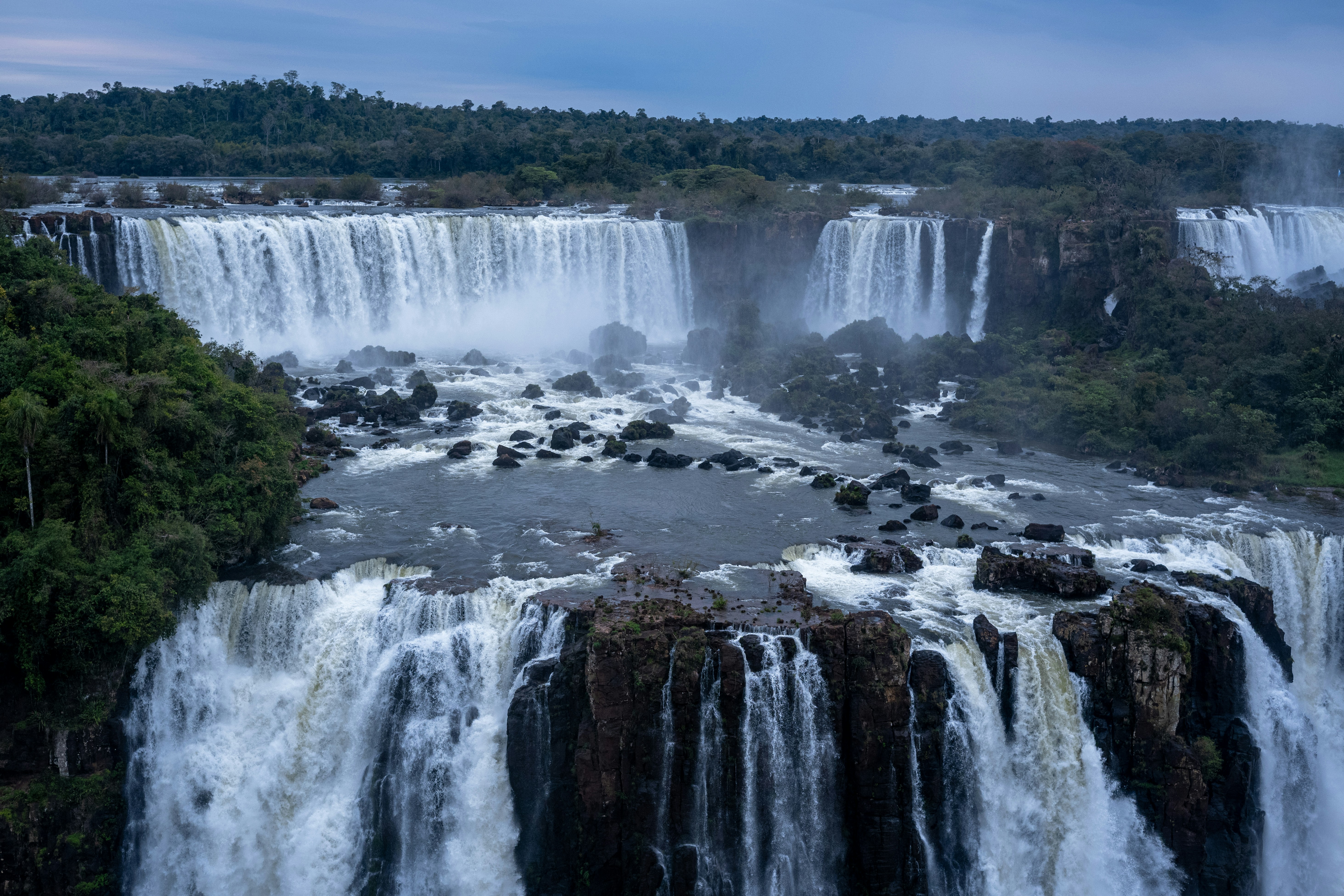 Jog Falls Karnataka massive waterfall cascading down rocky cliffs surrounded by lush green forest