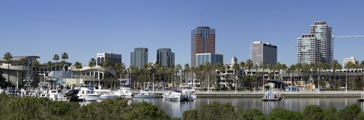 A boat on the water near city buildings