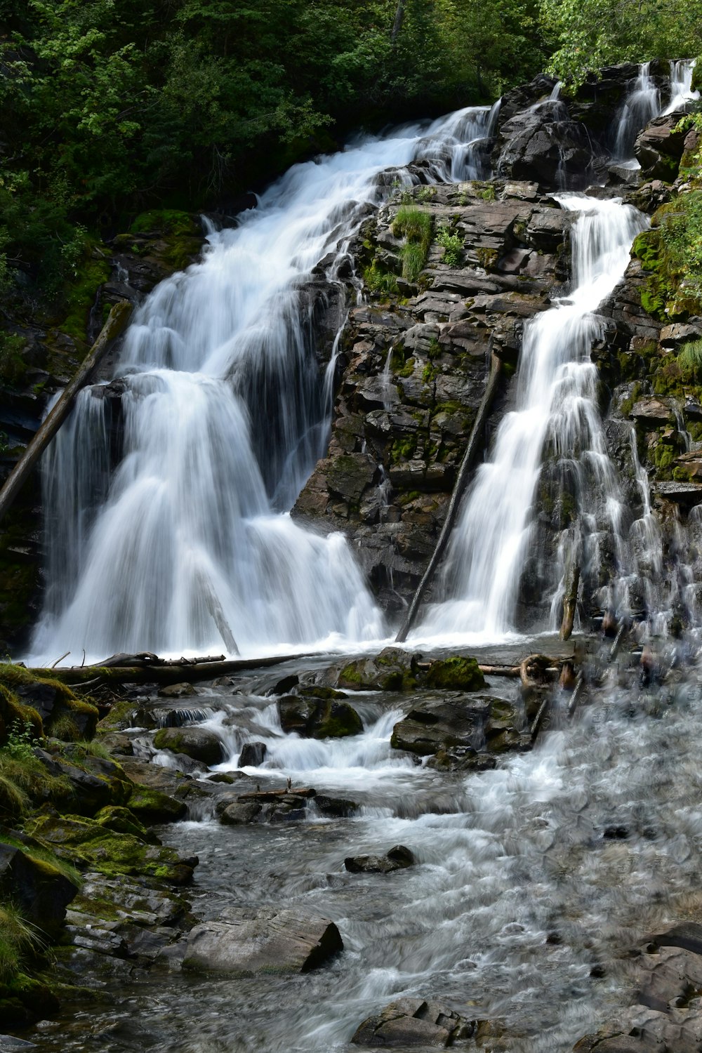 waterfalls on rocky mountain during daytime