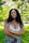 woman in white floral lace brassiere standing on green grass field during daytime