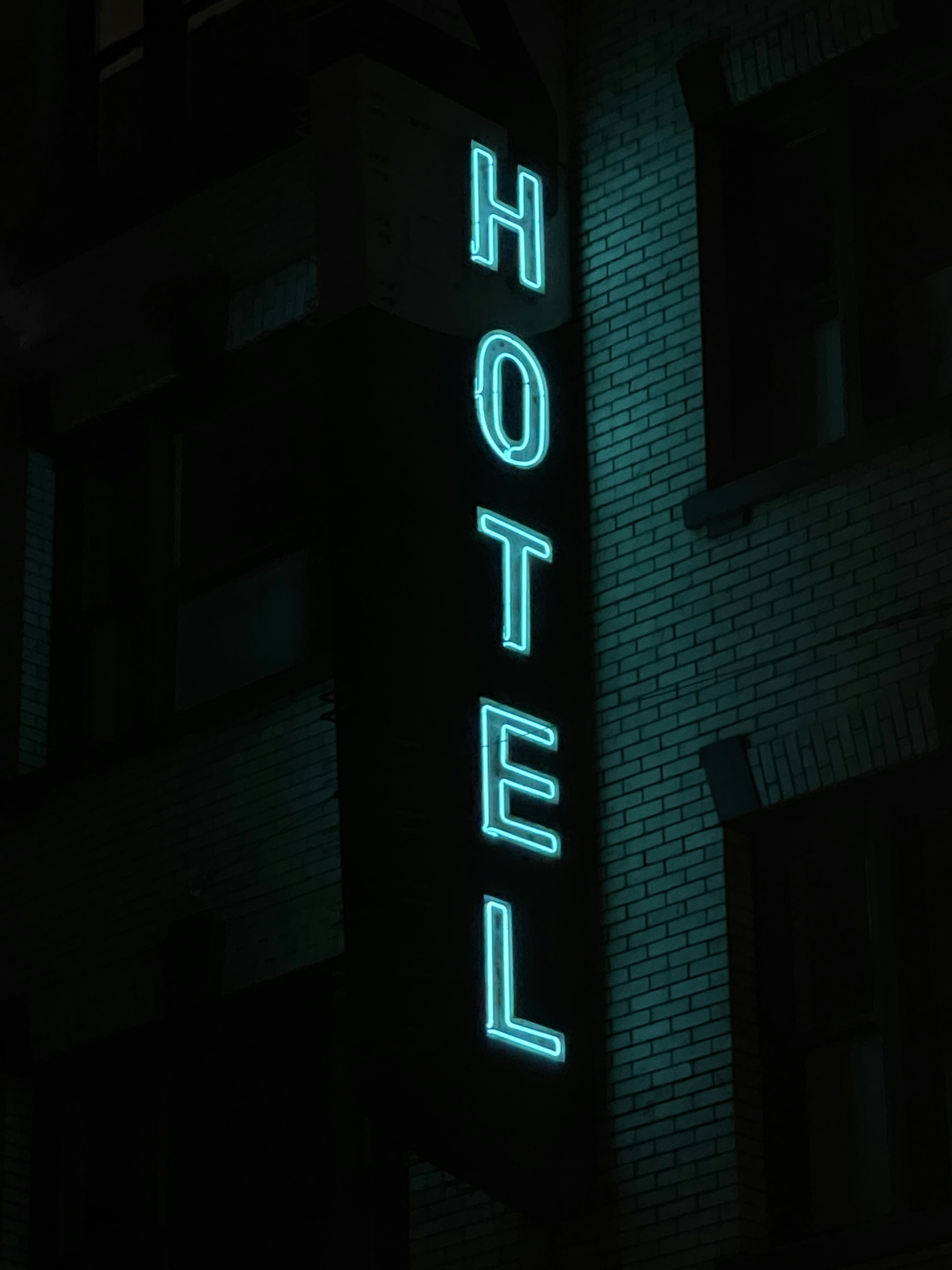 a neon sign on the side of a building