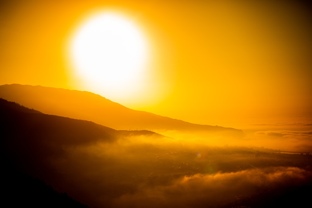 sun setting over the mountains