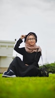 woman in black hijab and black abaya