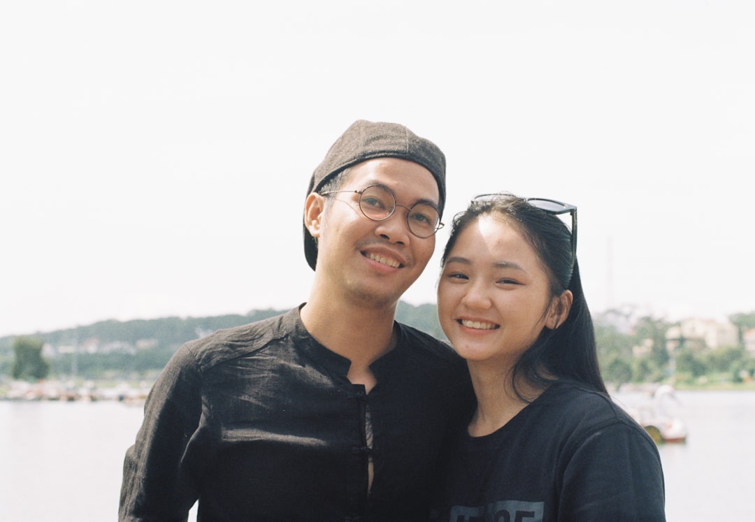 man in black crew neck shirt beside woman in black crew neck shirt