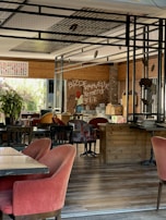 The warm, cozy interior of Ouderen Tafel with wooden tables and Dutch-themed decor.