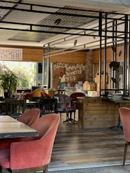 Cozy interior of La Regina with warm lighting and welcoming wooden decor.