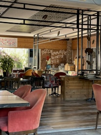 A cozy salon interior with warm earthy tones and comfortable seating.